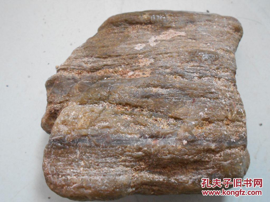 一块经过多年河流冲刷的树化玉原石约1斤