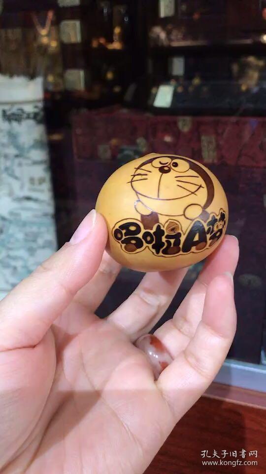 哆啦a梦手捻鸡蛋葫芦