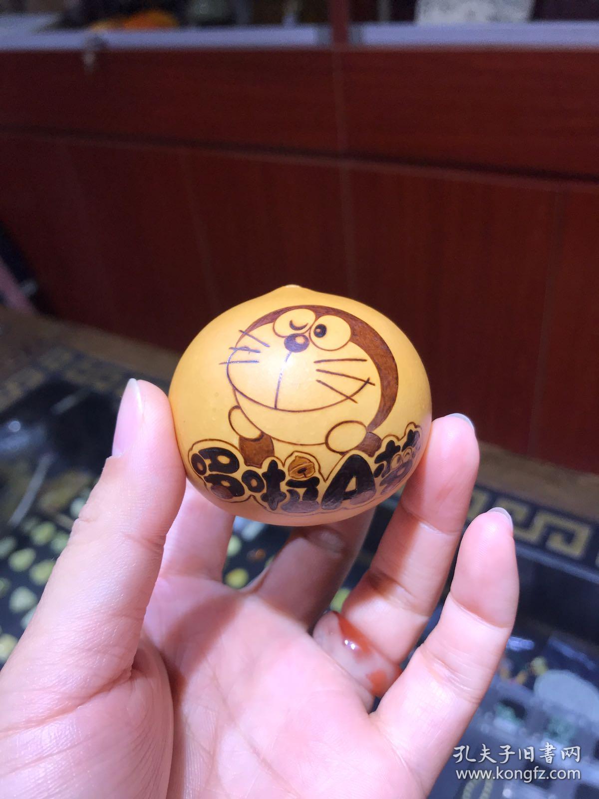 哆啦a梦手捻鸡蛋葫芦