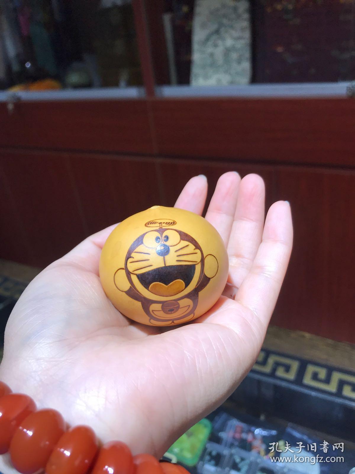 哆啦a梦手捻鸡蛋葫芦