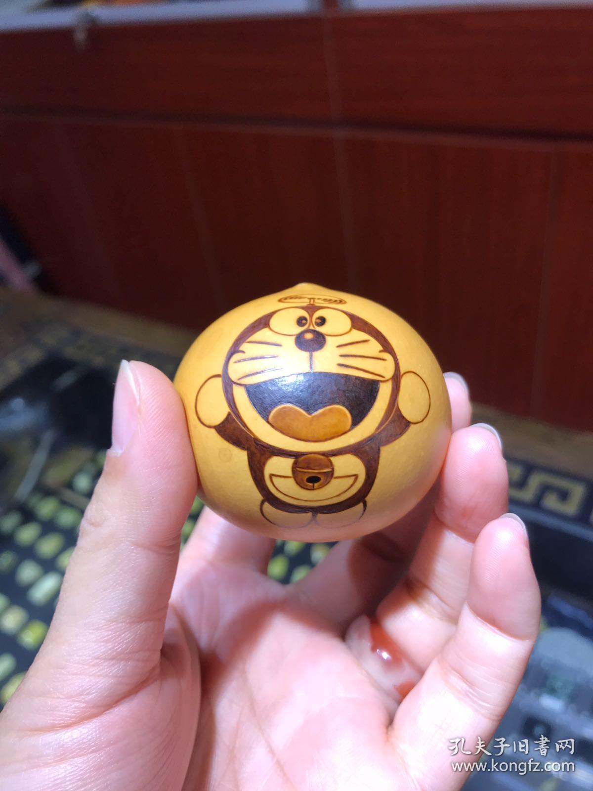 哆啦a梦手捻鸡蛋葫芦