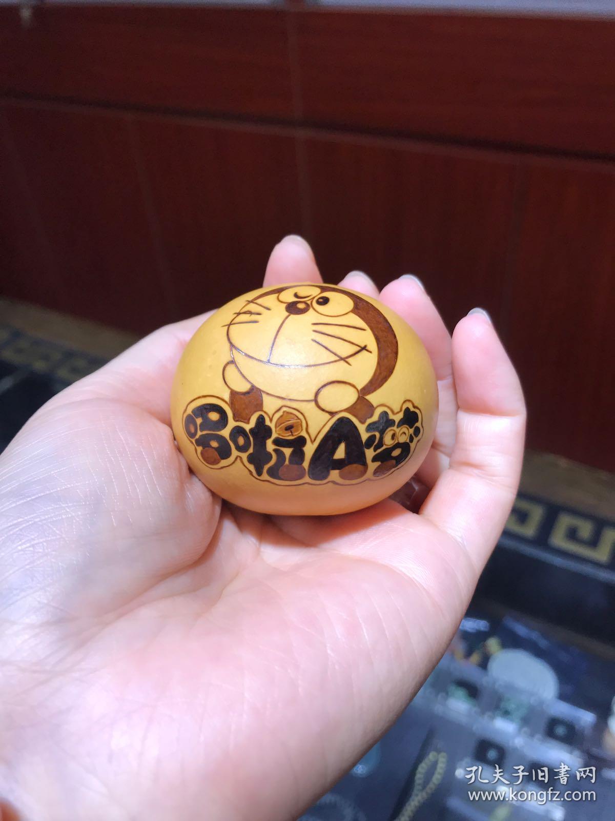 哆啦a梦手捻鸡蛋葫芦