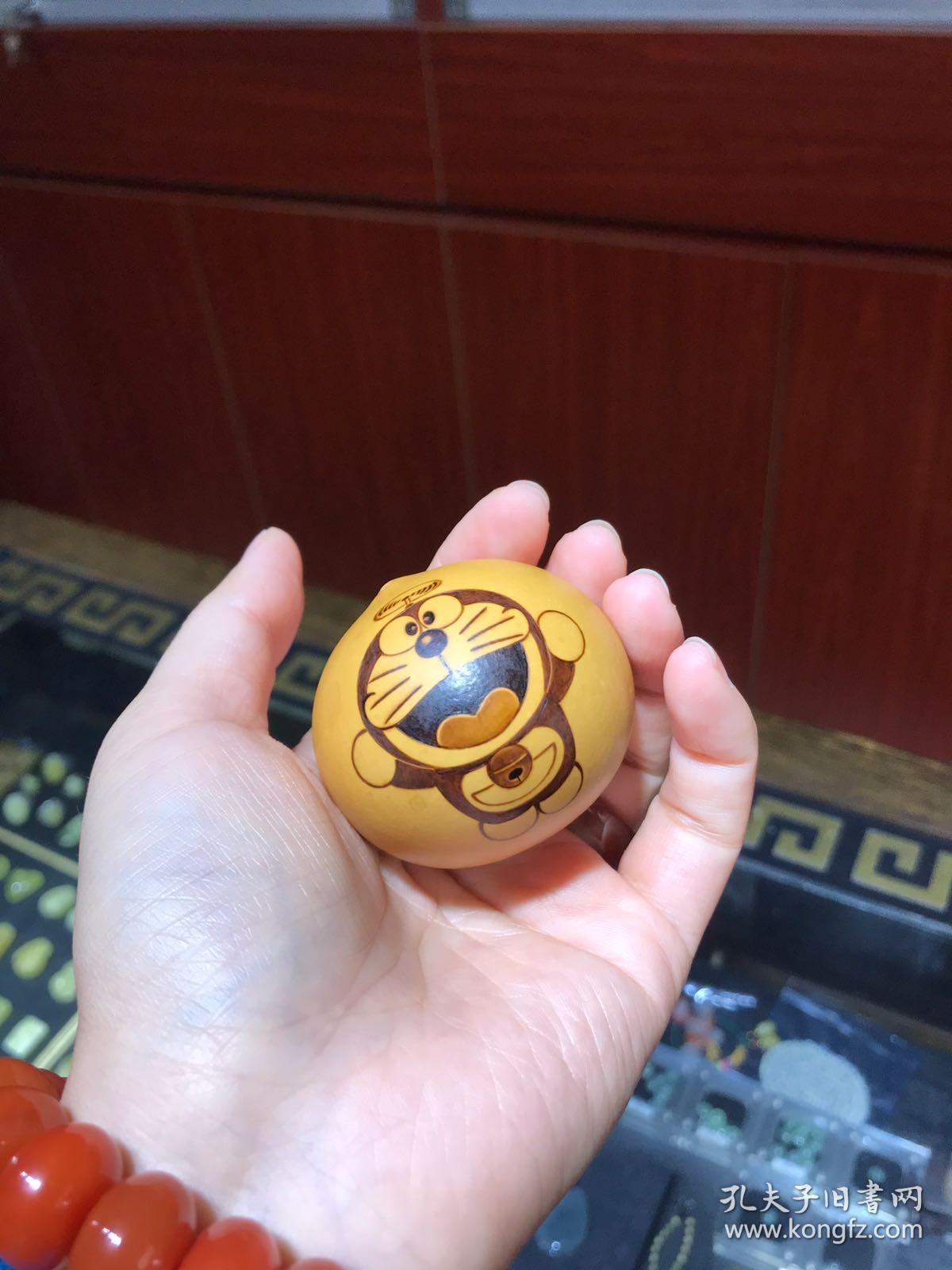 哆啦a梦手捻鸡蛋葫芦