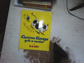 CURIOUS  GEORGE GETS  A MEDAL