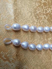 珍珠项链一条，长40厘米.珠子0.5厘米宽，正品，重量41.3克，特殊物品售后不退拍前看好